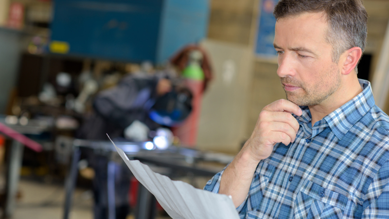 Man Reading Welding Report